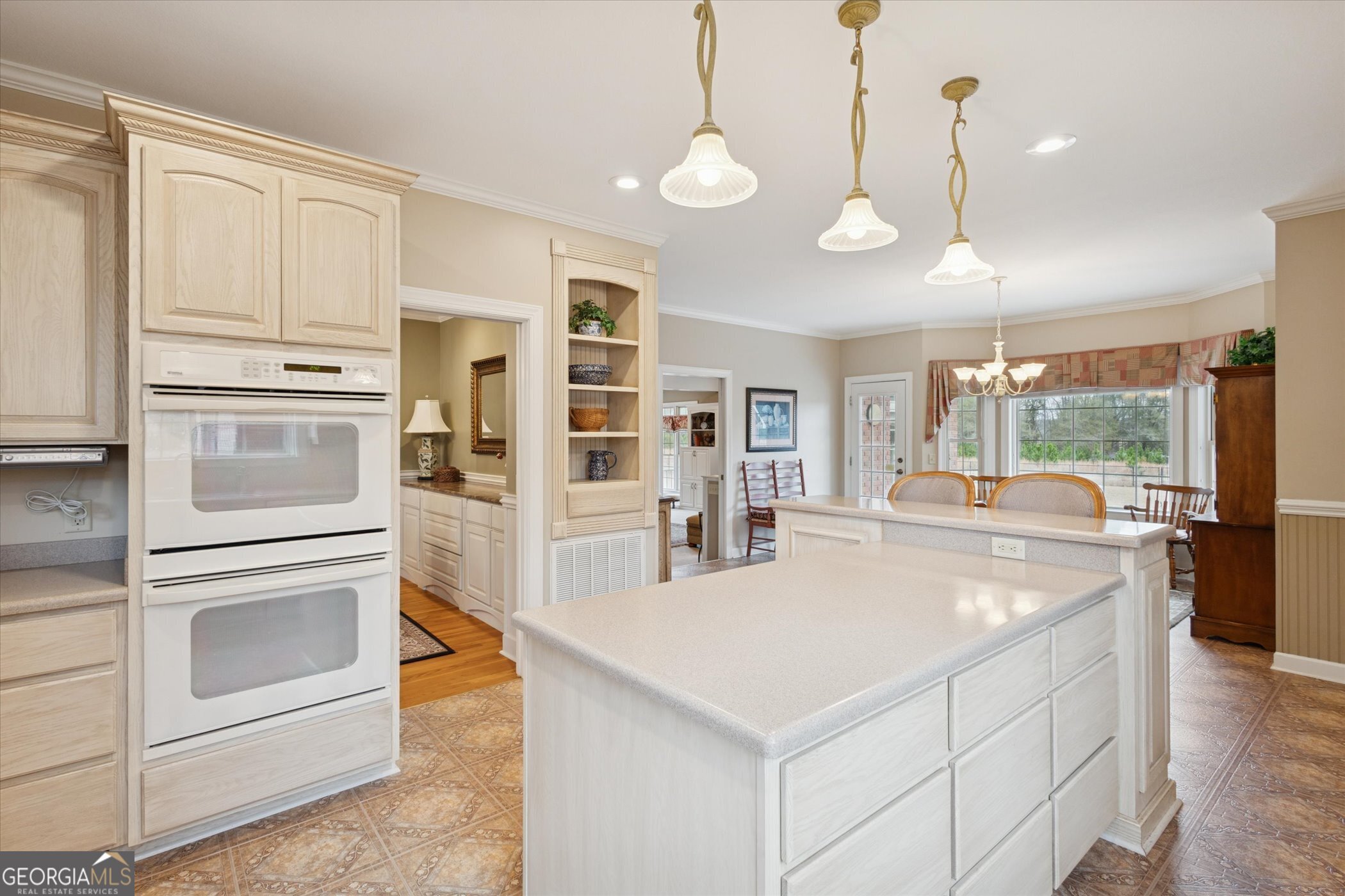 10544 Burkhalter Road Statesboro, GA 30461 - Photo 21 of 67 a kitchen with stainless steel appliances granite countertop a stove and a refrigerator