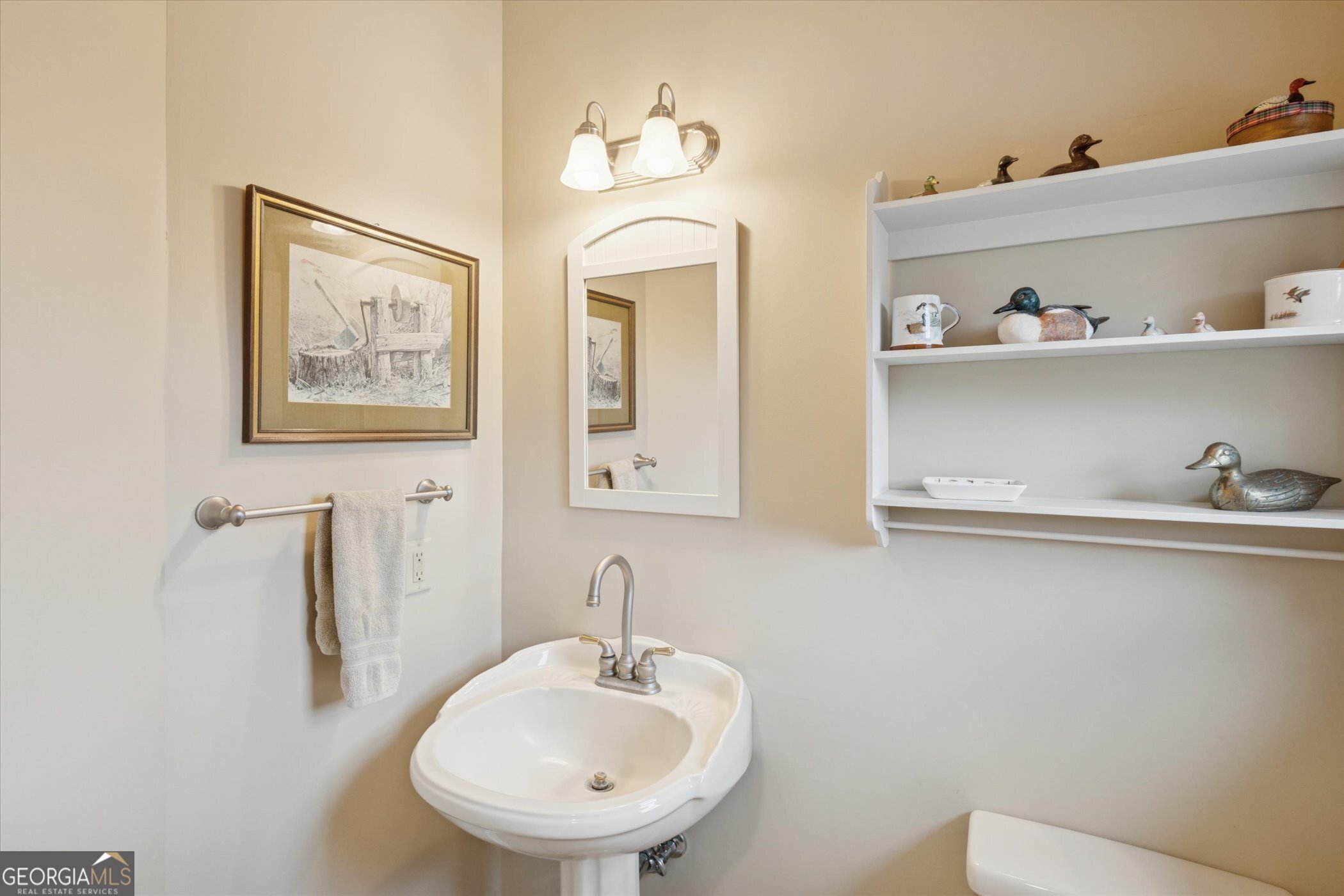 10544 Burkhalter Road Statesboro, GA 30461 - Photo 22 of 67 a bathroom with a sink and a mirror