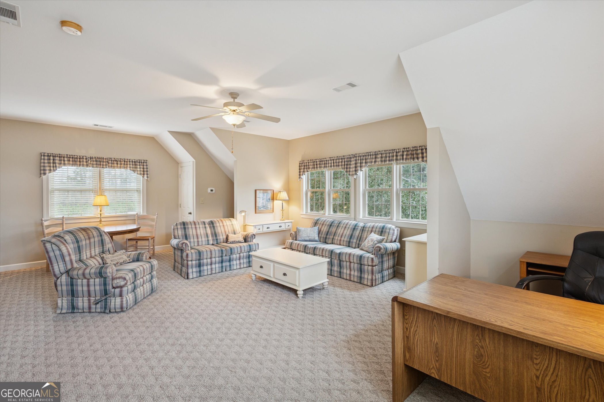 10544 Burkhalter Road Statesboro, GA 30461 - Photo 27 of 67 a living room with furniture and a large window