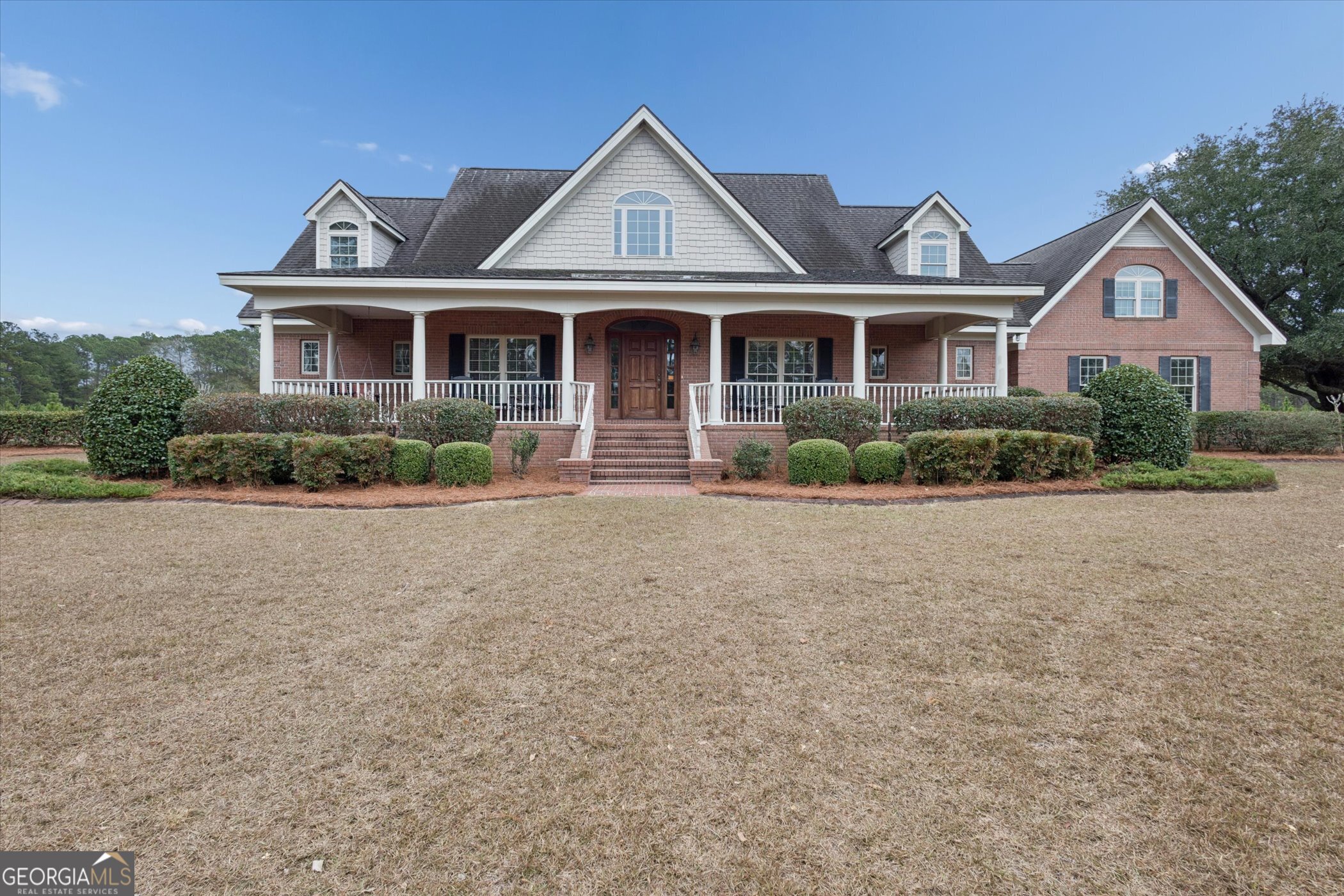 10544 Burkhalter Road Statesboro, GA 30461 - Photo 3 of 67 a front view of a house with a yard and potted plants