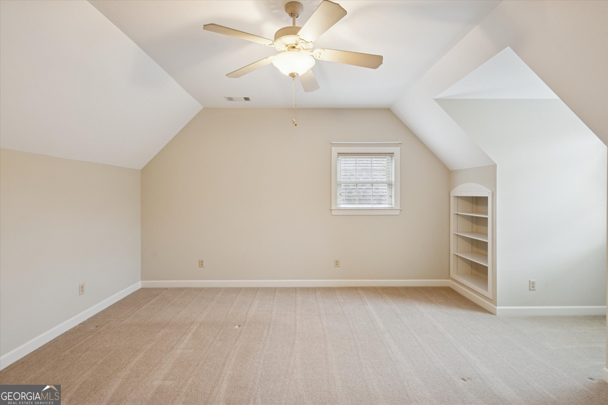 10544 Burkhalter Road Statesboro, GA 30461 - Photo 32 of 67 an empty room with a ceiling fan and a window