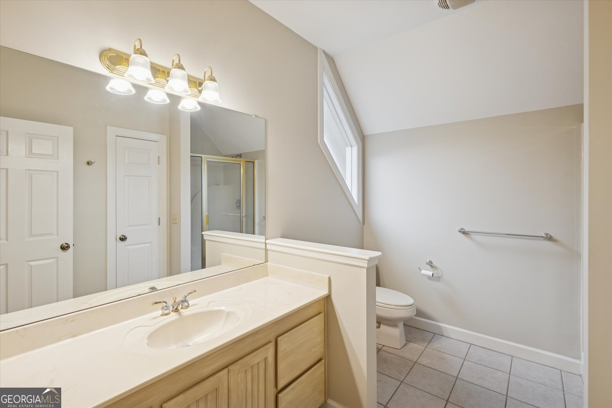 10544 Burkhalter Road Statesboro, GA 30461 - Photo 40 of 67 a bathroom with a granite countertop sink a toilet and a mirror