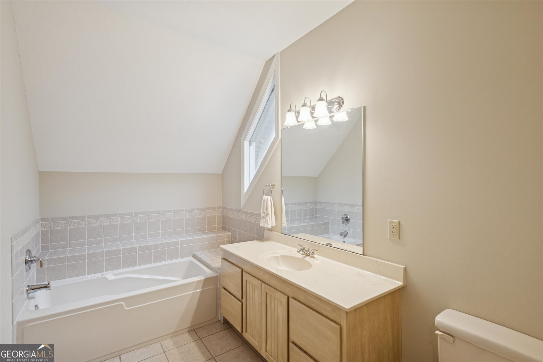 10544 Burkhalter Road Statesboro, GA 30461 - Photo 41 of 67 a bathroom with a sink and a mirror