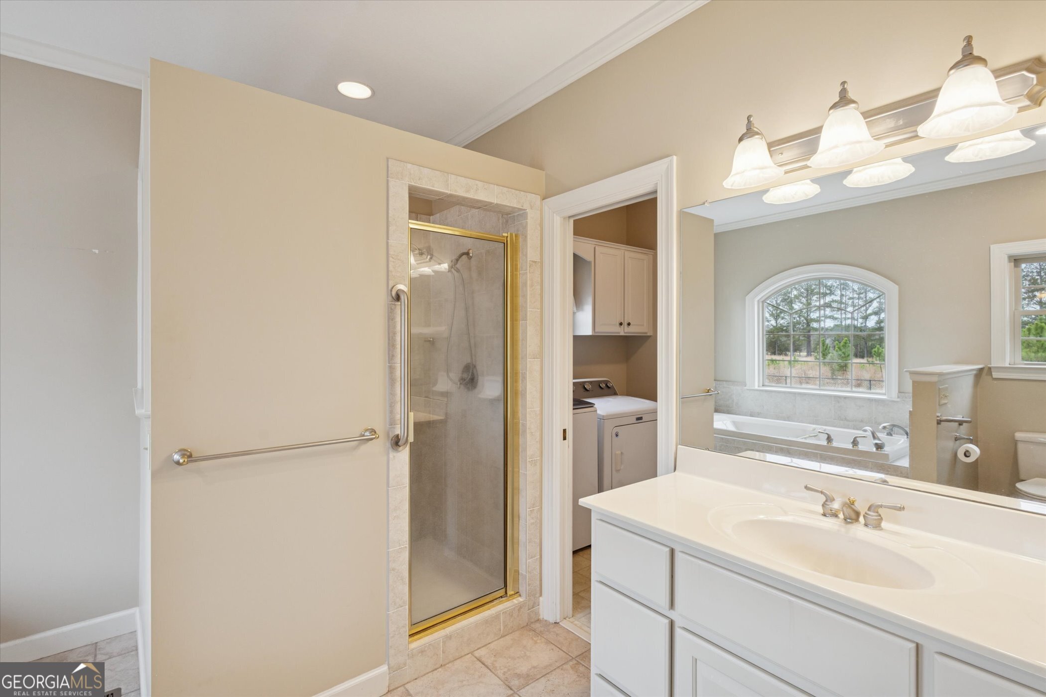 10544 Burkhalter Road Statesboro, GA 30461 - Photo 44 of 67 a bathroom with a sink and a mirror