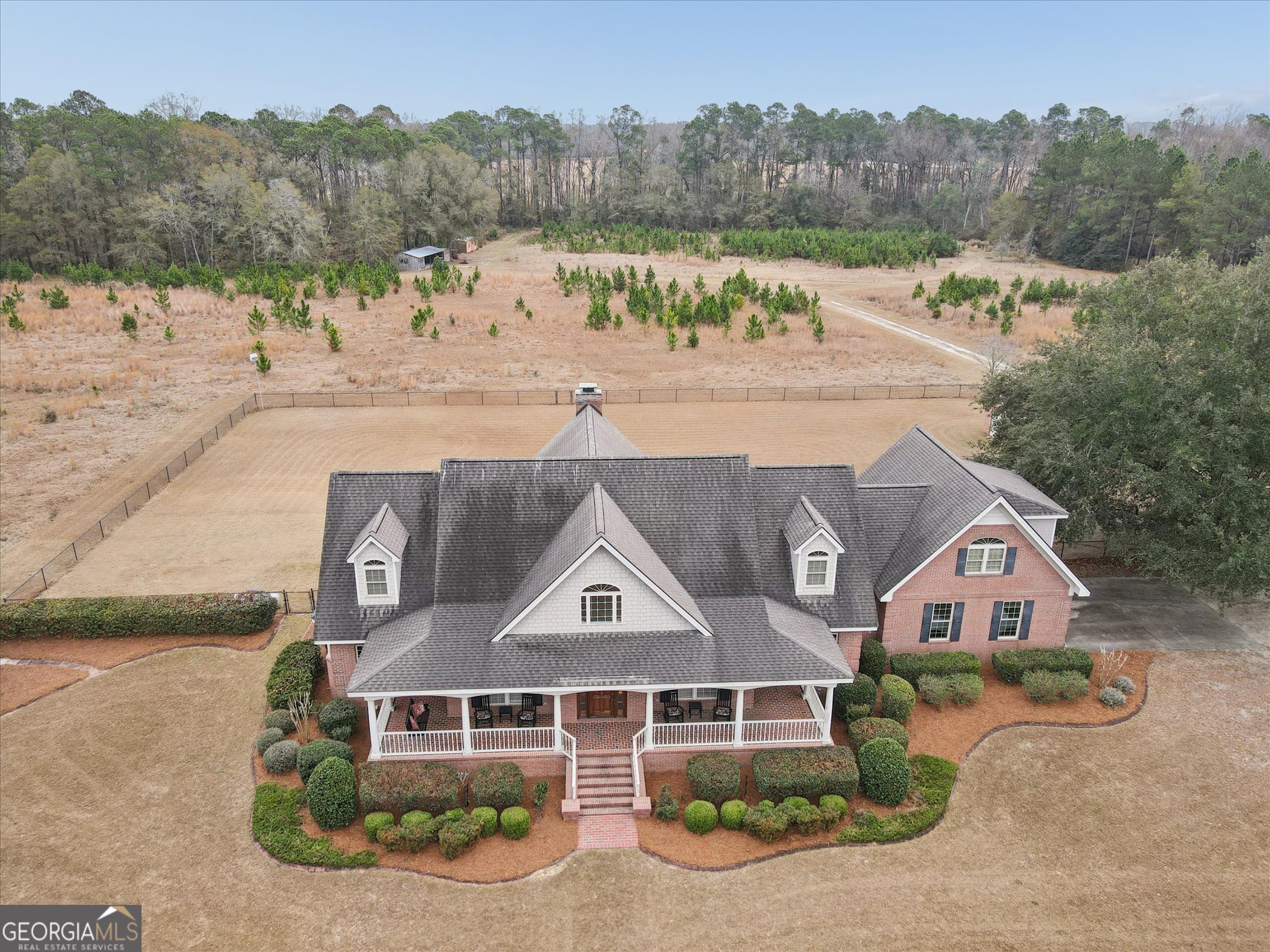 10544 Burkhalter Road Statesboro, GA 30461 - Photo 53 of 67 an aerial view of a house with a garden and a yard