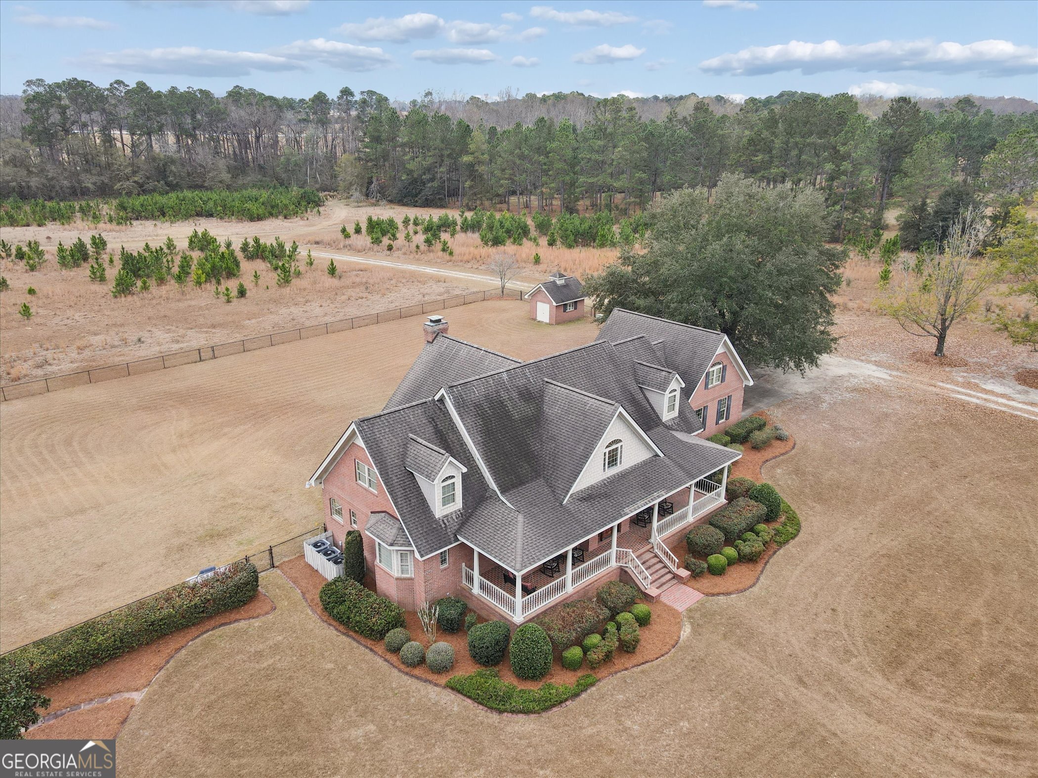 10544 Burkhalter Road Statesboro, GA 30461 - Photo 54 of 67 an aerial view of a house with a yard and lake view