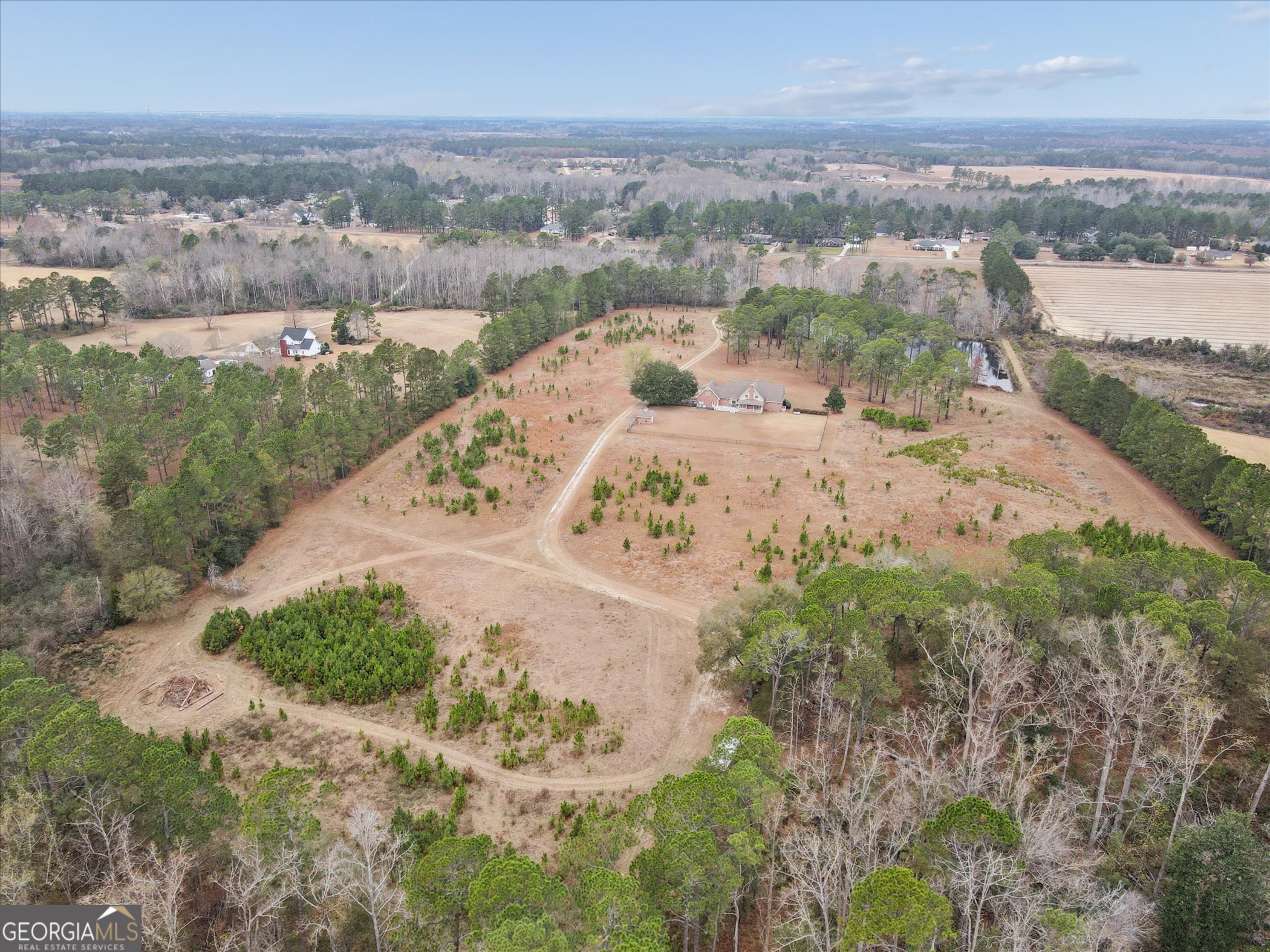 10544 Burkhalter Road Statesboro, GA 30461 - Photo 56 of 67 a view of a lake with beach and city view