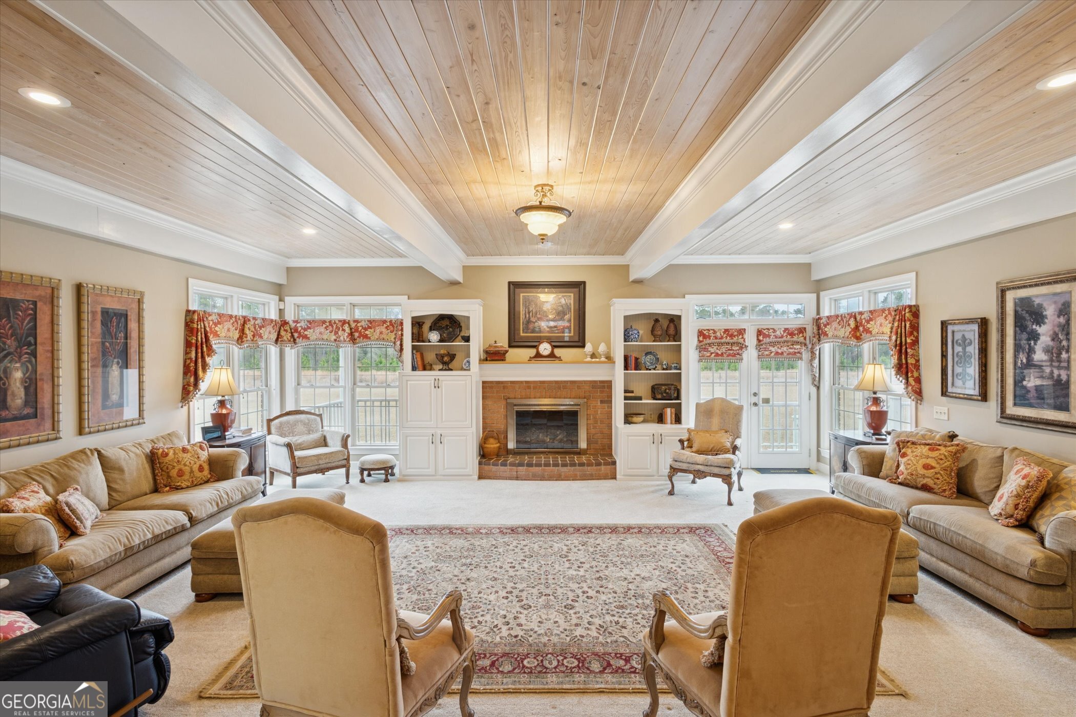 10544 Burkhalter Road Statesboro, GA 30461 - Photo 8 of 67 a living room with furniture flat screen tv and a large window