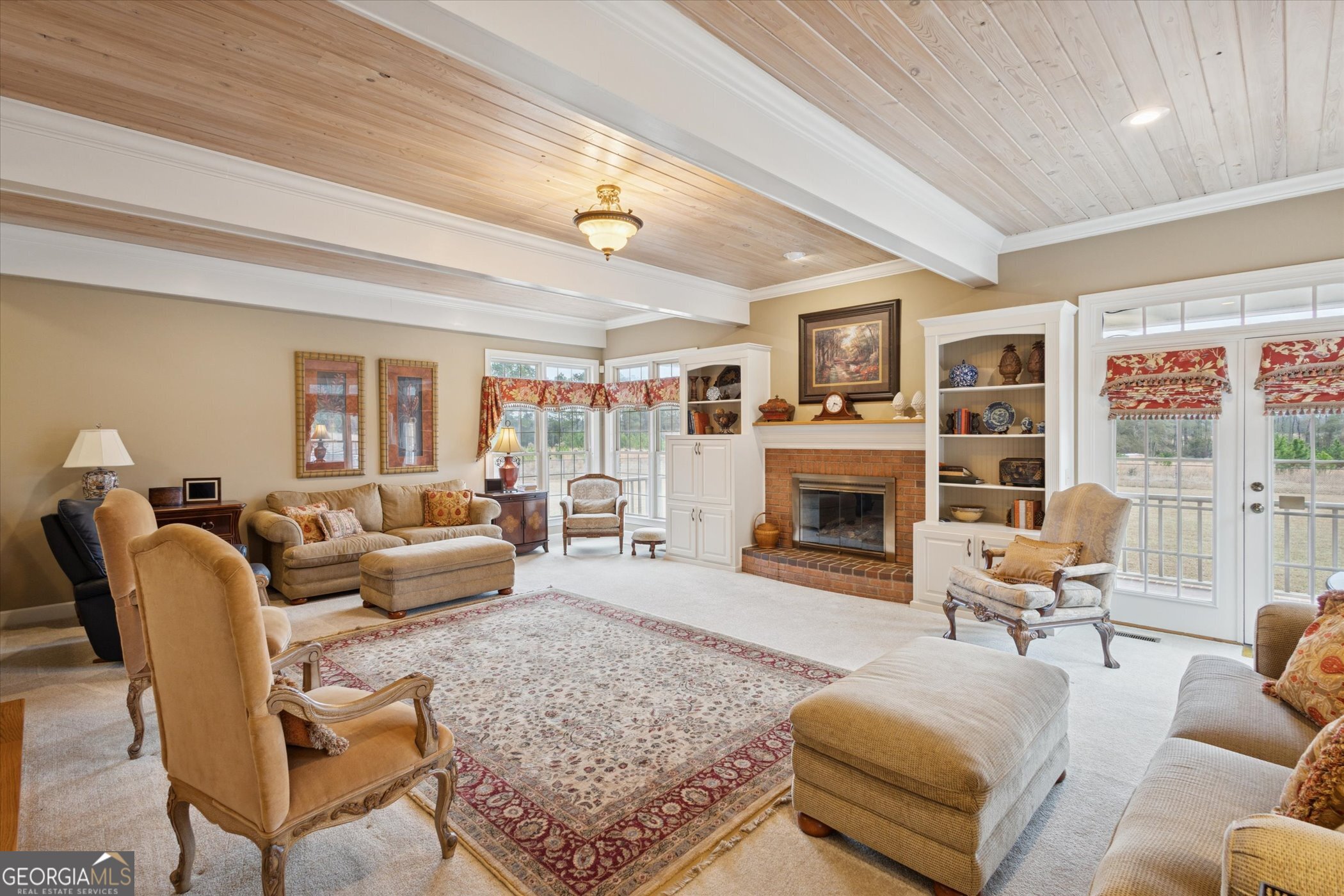 10544 Burkhalter Road Statesboro, GA 30461 - Photo 9 of 67 a living room with furniture large window and a fireplace