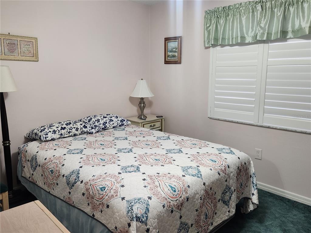 6505 Stone River Road, Unit 304 Bradenton, FL 34203 - Photo 13 of 38 a bedroom with a bed and a window