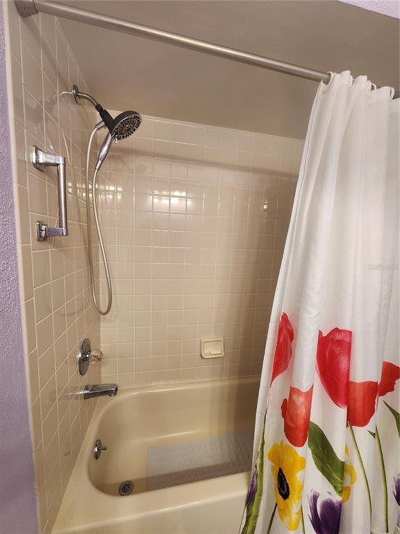 6505 Stone River Road, Unit 304 Bradenton, FL 34203 - Photo 15 of 38 a bathroom with a bathtub and shower