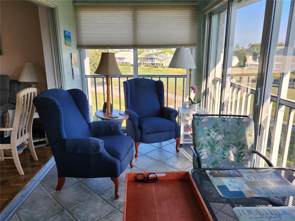 6505 Stone River Road, Unit 304 Bradenton, FL 34203 - Photo 16 of 38 a living room with furniture and a large window