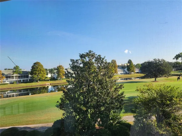 a view of a lake with a yard