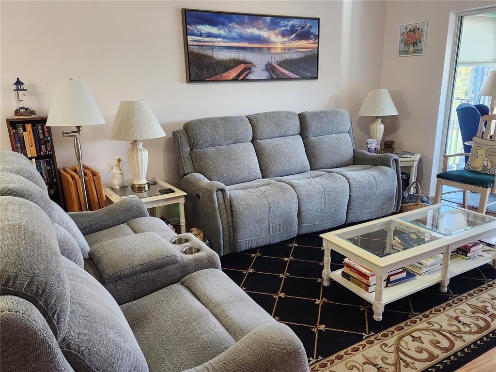 6505 Stone River Road, Unit 304 Bradenton, FL 34203 - Photo 2 of 38 a living room with furniture and a window