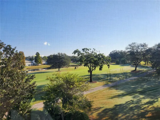 a view of a water fountain and a big yard