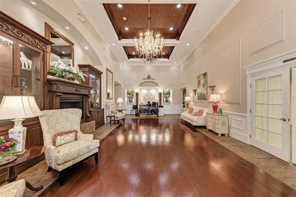 a dining room with stainless steel appliances kitchen island granite countertop a table and chairs