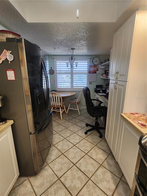 6505 Stone River Road, Unit 304 Bradenton, FL 34203 - Photo 7 of 38 a view of a workspace with furniture and a window