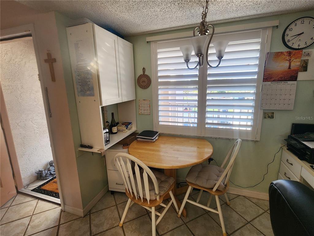 6505 Stone River Road, Unit 304 Bradenton, FL 34203 - Photo 8 of 38 a dining room with furniture and window