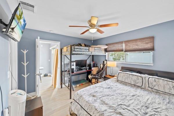 9302 Southwest 5th Street, Unit B Boca Raton, FL 33428 - Photo 20 of 26 a living room with furniture a fireplace and a large window