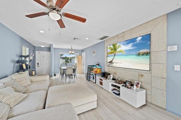 9302 Southwest 5th Street, Unit B Boca Raton, FL 33428 - Photo 9 of 26 a living room with furniture and a large window