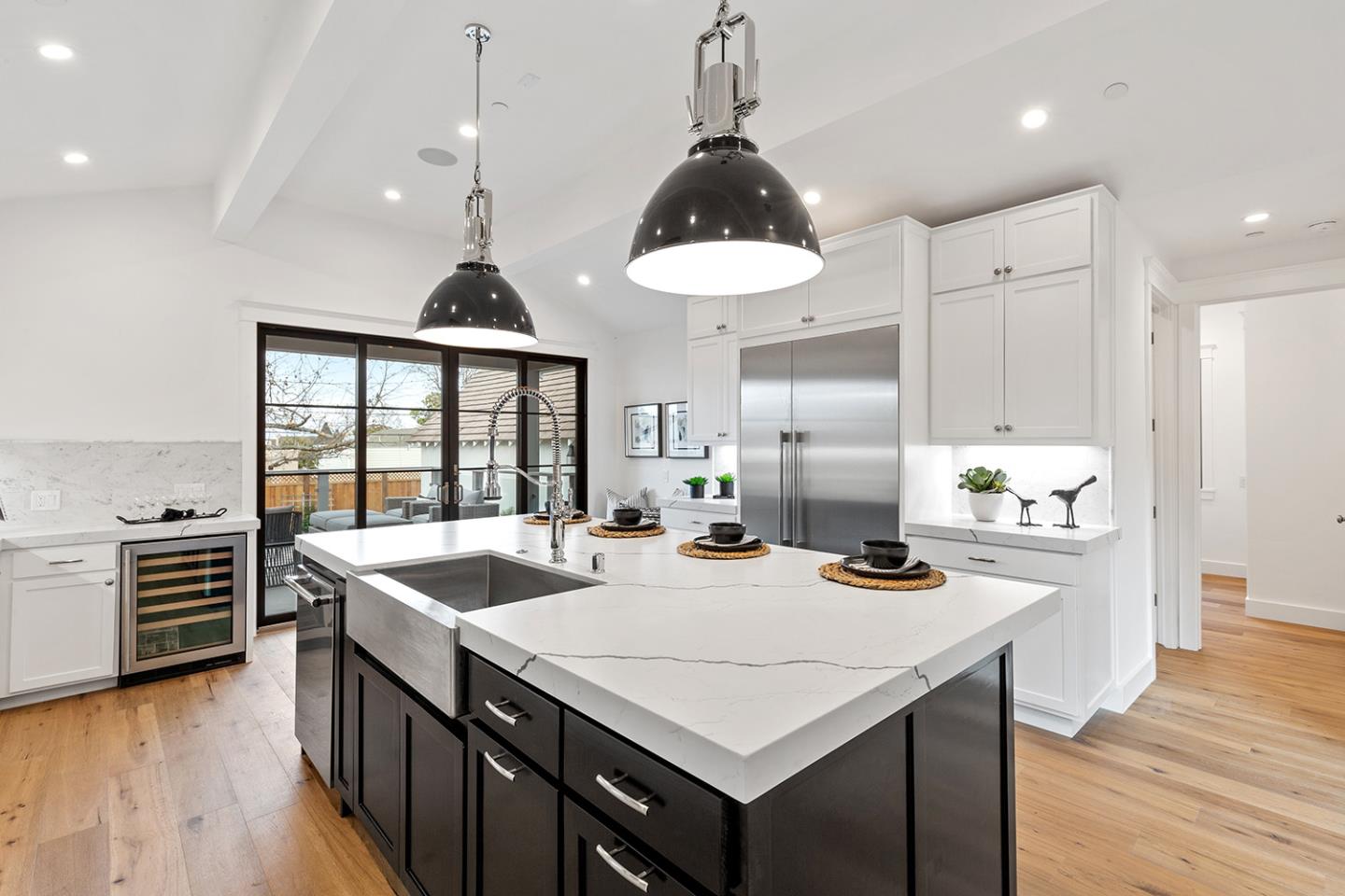 1324 Castillo Avenue Burlingame, CA 94010 - Photo 18 of 50 a kitchen with stainless steel appliances a stove a sink a kitchen island with wooden cabinets and wooden floor