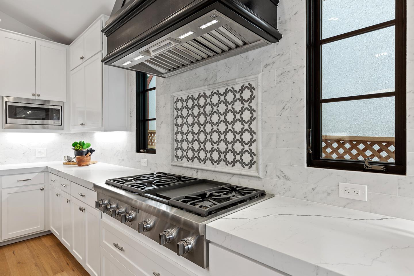 1324 Castillo Avenue Burlingame, CA 94010 - Photo 21 of 50 a kitchen with granite countertop a stove and a sink