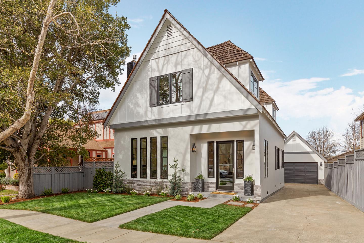 1324 Castillo Avenue Burlingame, CA 94010 - Photo 3 of 50 a view of a white house with a small yard and large tree