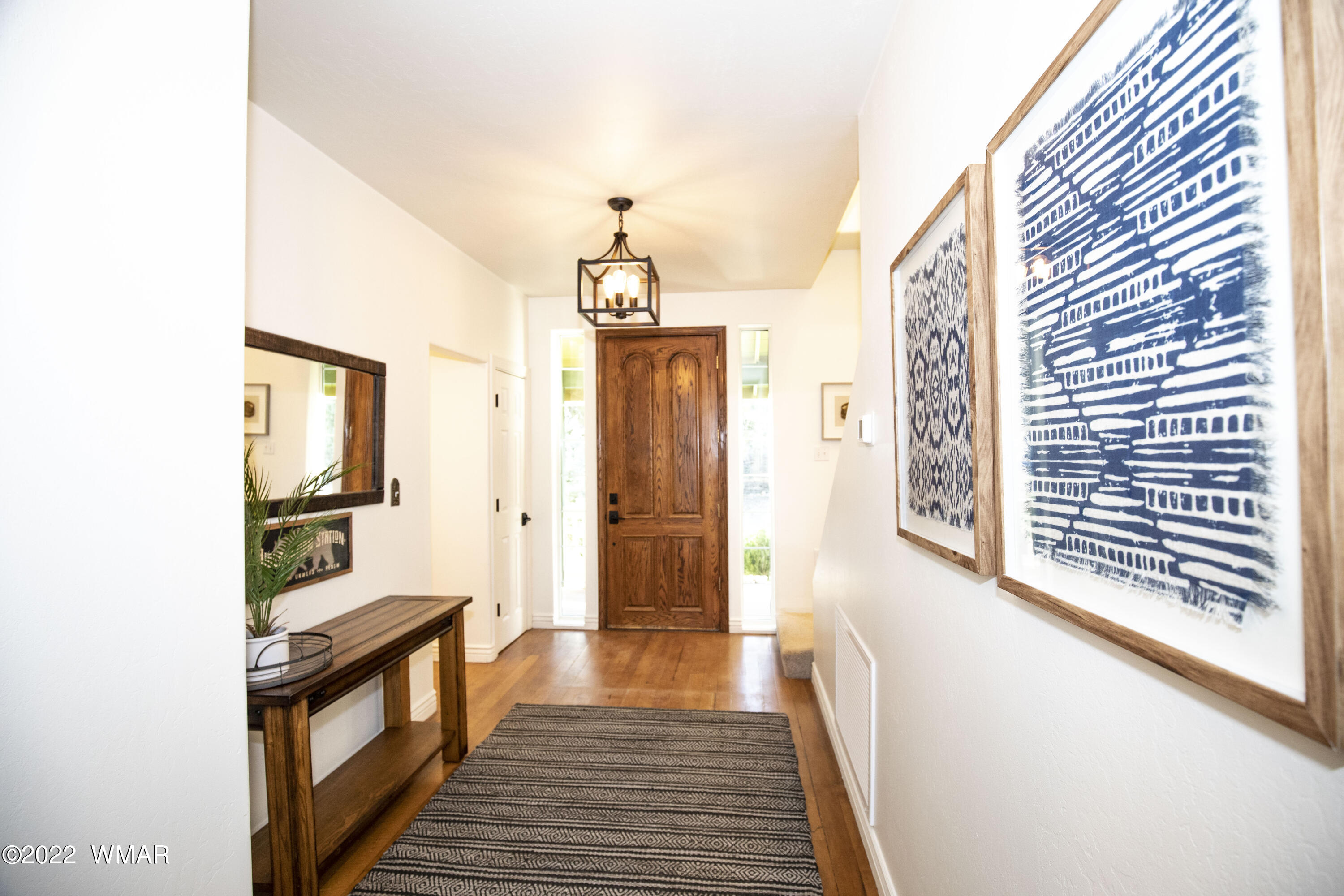 1940 Artist Draw Road Heber, AZ 85928 - Photo 54 of 73 a view of a hallway with wooden floor and staircase