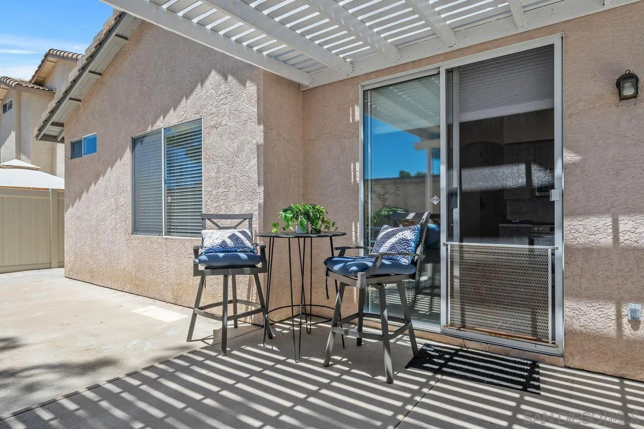 27497 Marian Road Temecula, CA 92591 - Photo 26 of 39 a patio with table and chairs and potted plants
