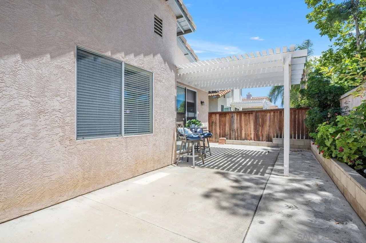 27497 Marian Road Temecula, CA 92591 - Photo 28 of 39 a balcony with table and chairs and potted plants