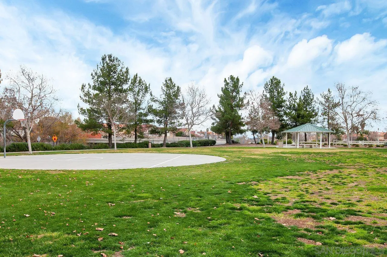 27497 Marian Road Temecula, CA 92591 - Photo 36 of 39 a view of grassy field with benches and trees all around