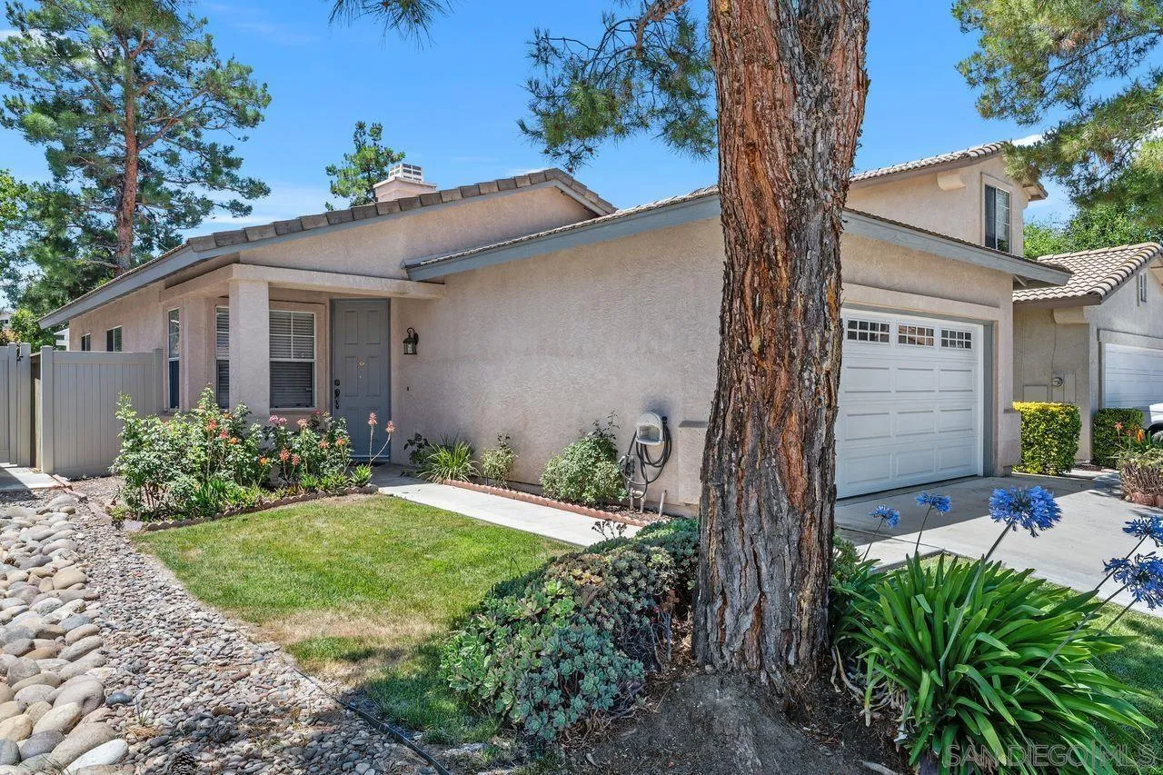 27497 Marian Road Temecula, CA 92591 - Photo 4 of 39 a front view of a house with garden