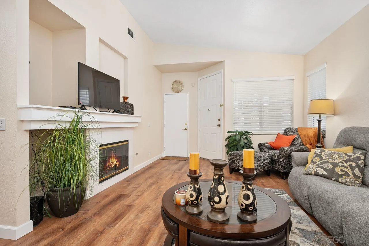 27497 Marian Road Temecula, CA 92591 - Photo 8 of 39 a living room with furniture a fireplace and a flat screen tv