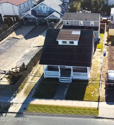 an aerial view of houses with sky view