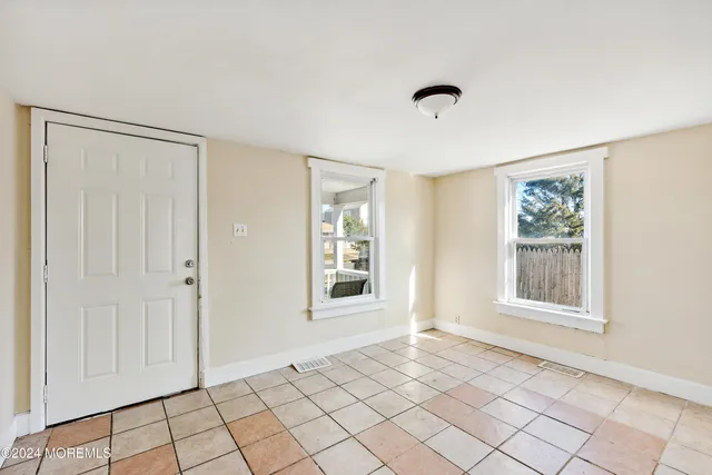 a view of an entryway and livingroom