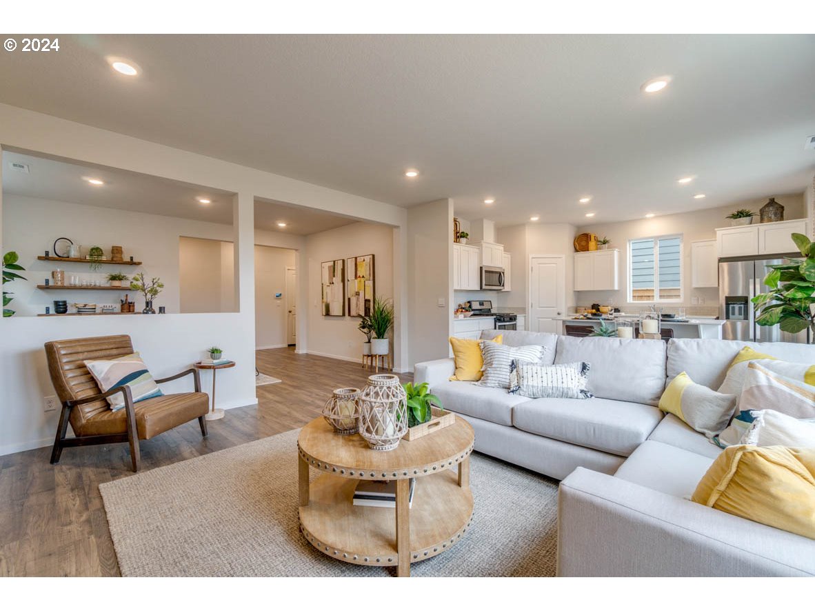 2942 U Street Springfield, OR 97477 - Photo 9 of 30 a living room with furniture and a view of kitchen