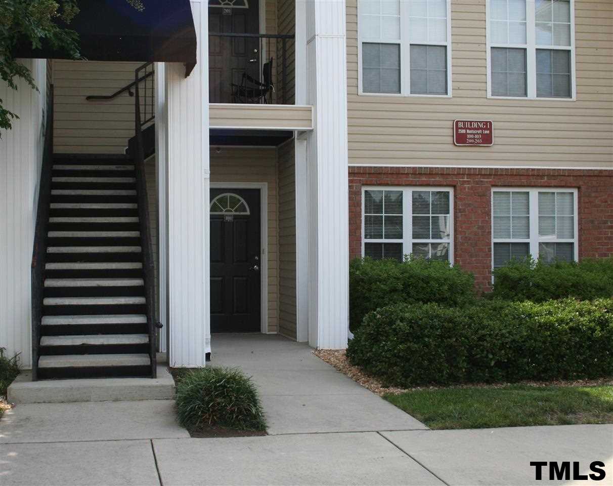 2500 Huntscroft Lane, Unit 101 Raleigh, NC 27617 - Photo 1 of 22 a front view of a house with a yard