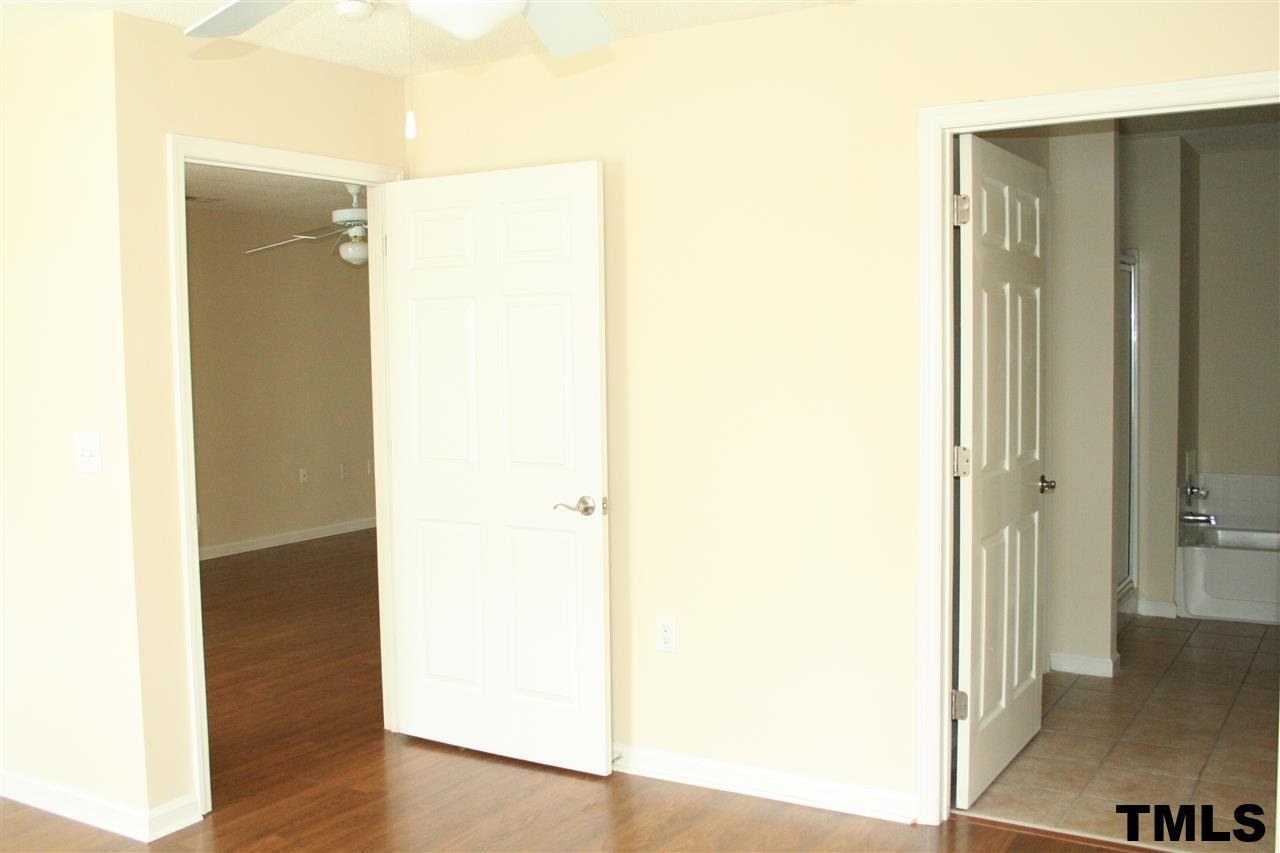 2500 Huntscroft Lane, Unit 101 Raleigh, NC 27617 - Photo 11 of 22 a view of hallway with wooden floor