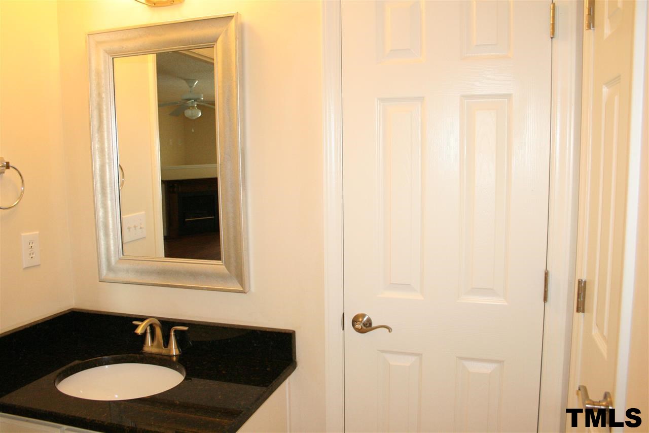2500 Huntscroft Lane, Unit 101 Raleigh, NC 27617 - Photo 15 of 22 a bathroom with a sink and a mirror