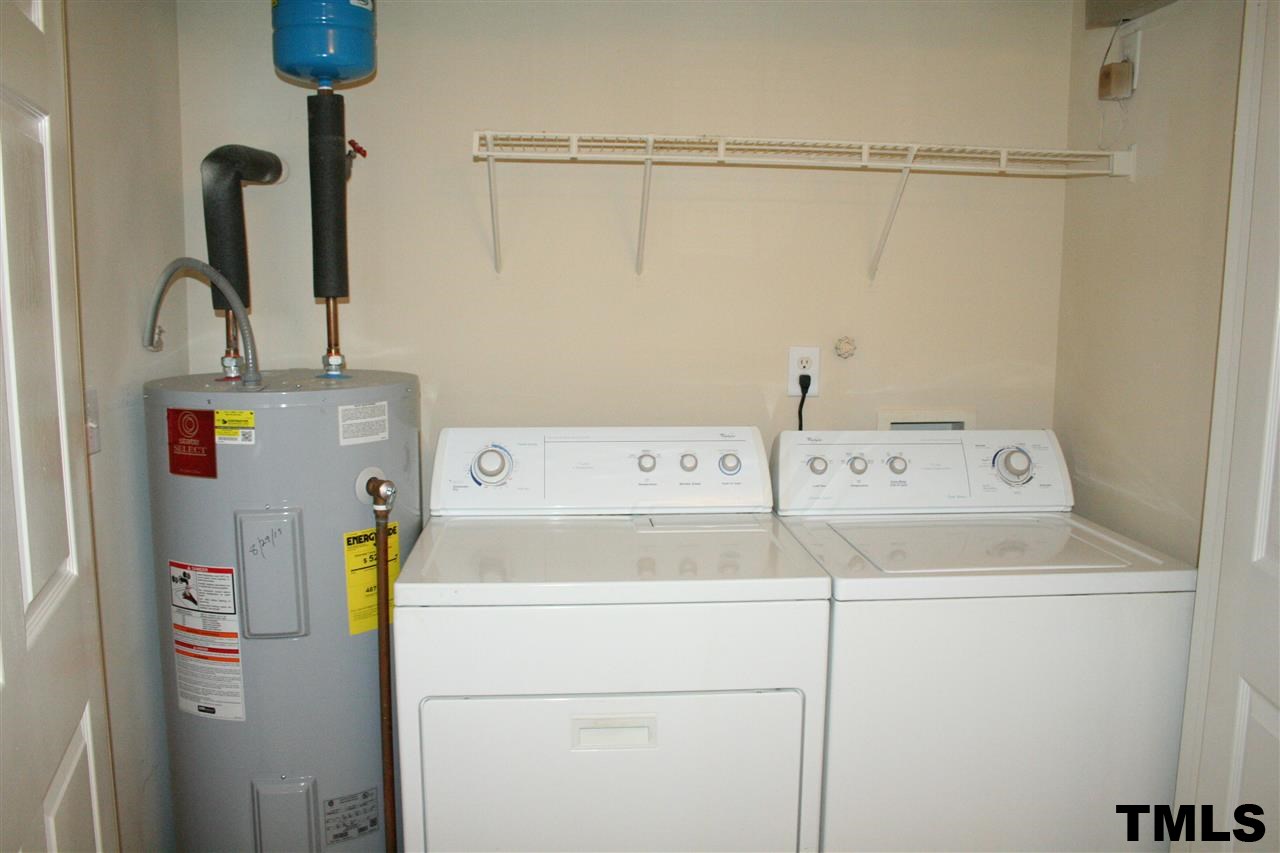2500 Huntscroft Lane, Unit 101 Raleigh, NC 27617 - Photo 16 of 22 a utility room with dryer and washer