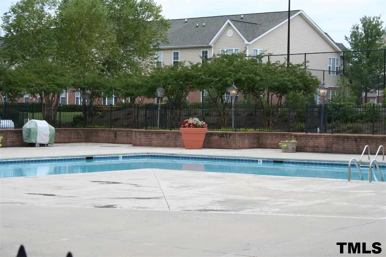 2500 Huntscroft Lane, Unit 101 Raleigh, NC 27617 - Photo 20 of 22 a front view of a house with a yard