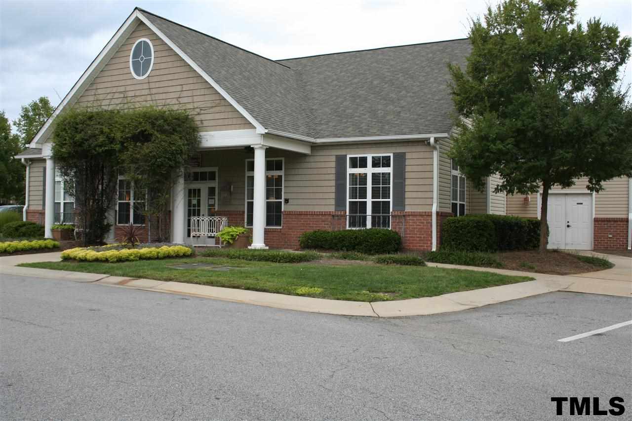 2500 Huntscroft Lane, Unit 101 Raleigh, NC 27617 - Photo 21 of 22 a front view of a house with a yard and garage