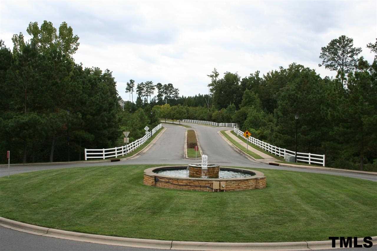 2500 Huntscroft Lane, Unit 101 Raleigh, NC 27617 - Photo 22 of 22 a view of a house with a yard