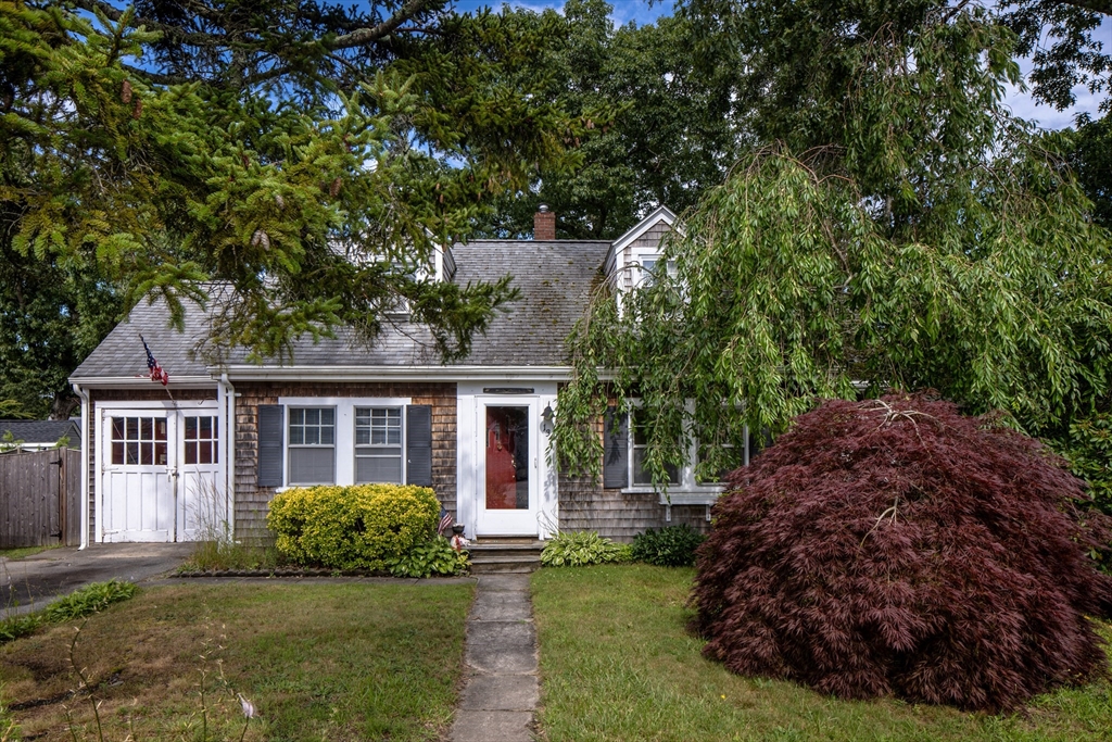 134 Swifts Beach Road Wareham, MA 02571 - Photo 1 of 1 a view of backyard with a garden and plants