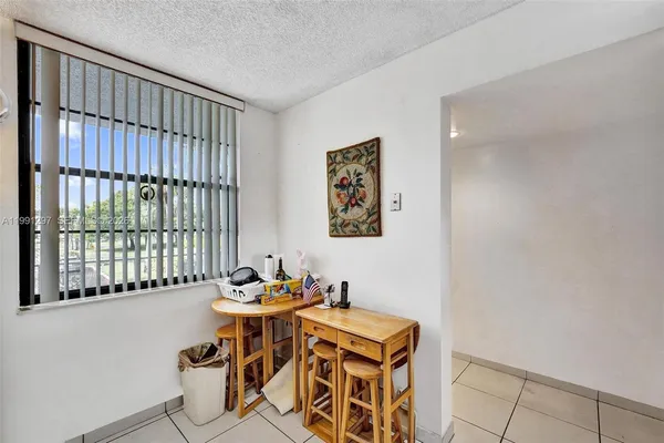 a kitchen with a stove and a refrigerator