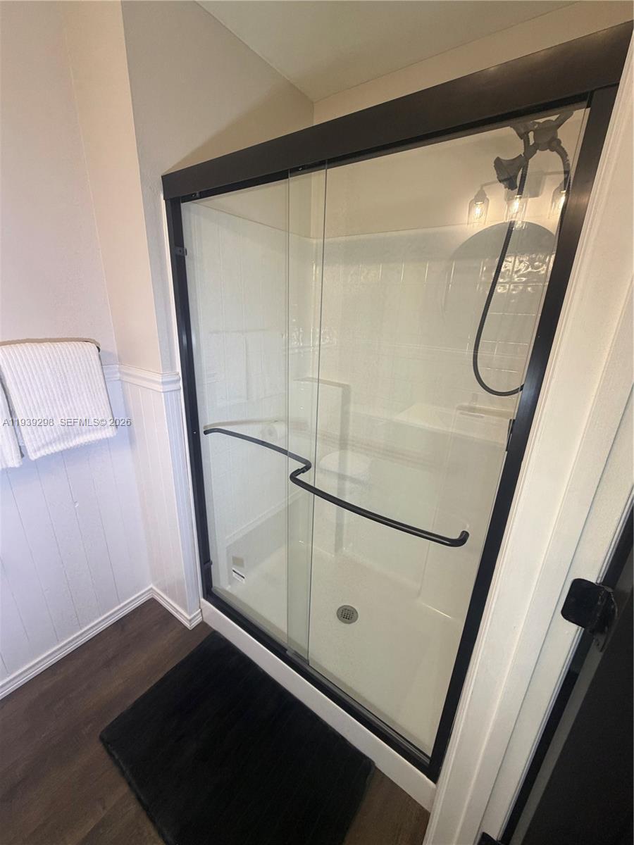 7 Zeidler Place Palm Coast, FL 32164 - Photo 12 of 26 a bathroom with a glass shower door and sink