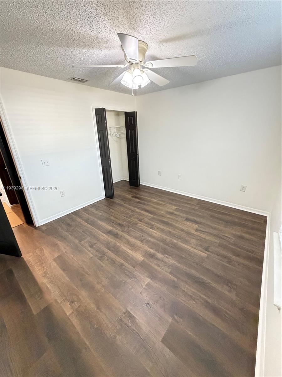 7 Zeidler Place Palm Coast, FL 32164 - Photo 17 of 26 a view of a livingroom with a ceiling fan and wooden floor