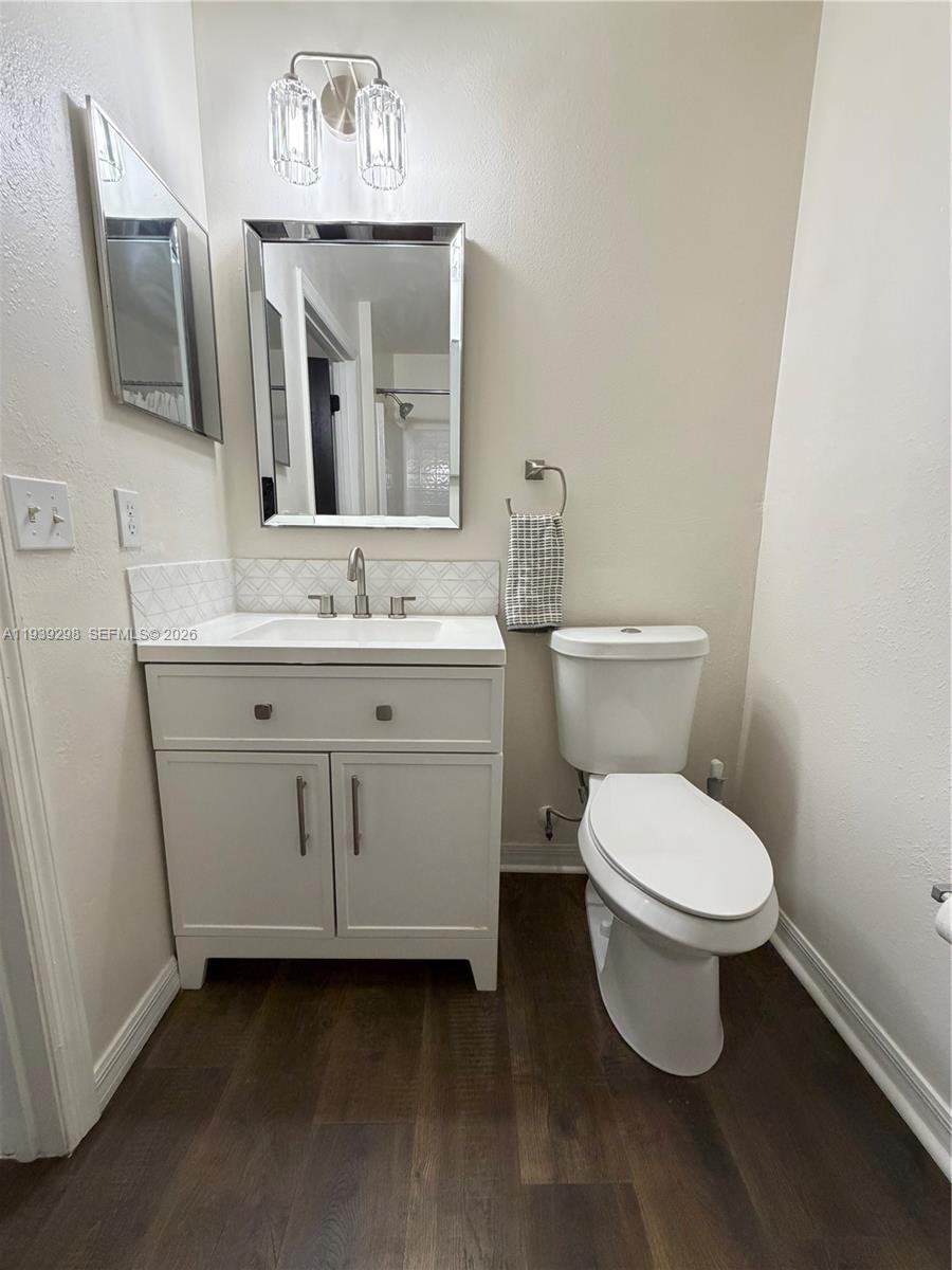 7 Zeidler Place Palm Coast, FL 32164 - Photo 19 of 26 a bathroom with a toilet sink and mirror