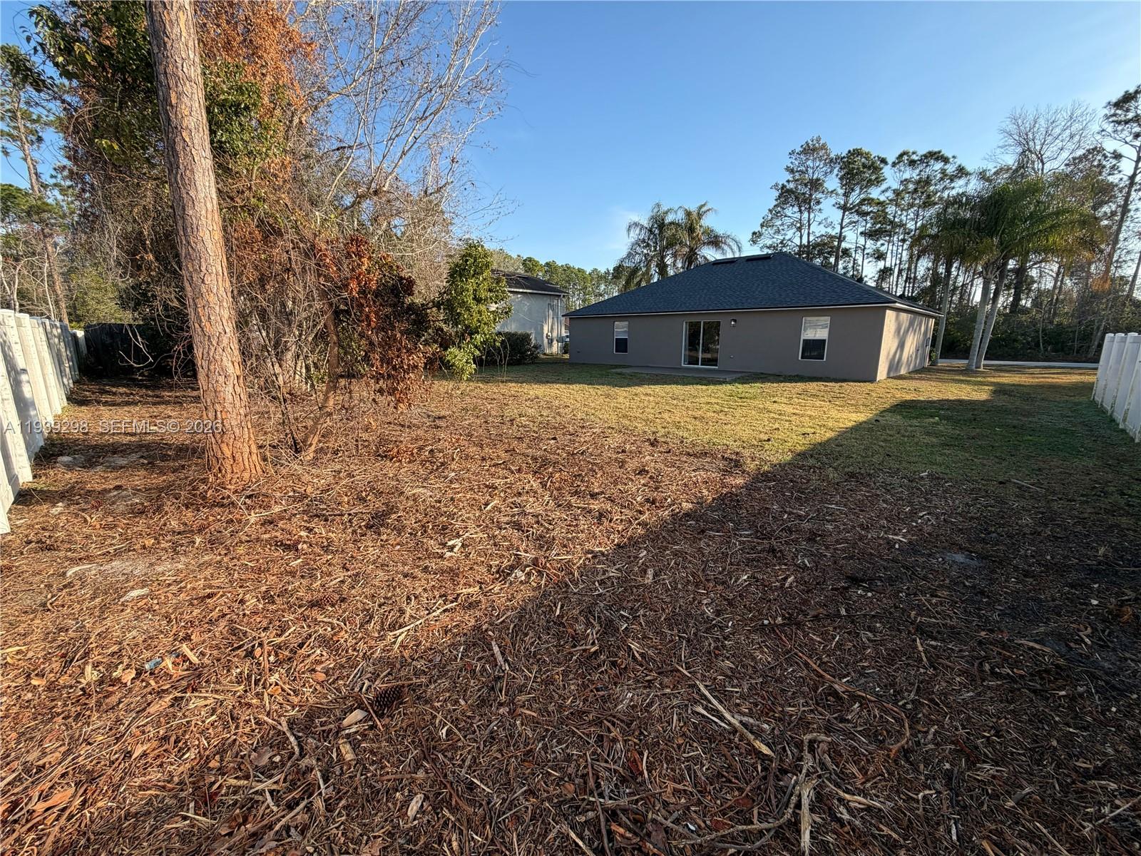 7 Zeidler Place Palm Coast, FL 32164 - Photo 22 of 26 a view of a house with a yard