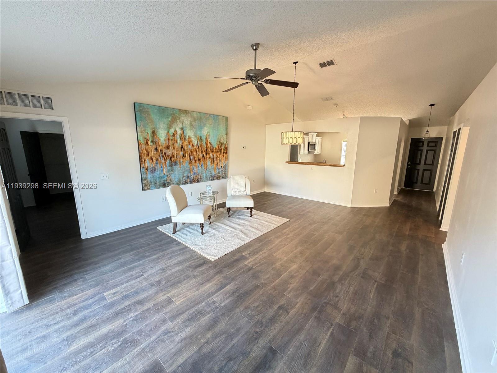 7 Zeidler Place Palm Coast, FL 32164 - Photo 7 of 26 a living room with furniture and a flat screen tv